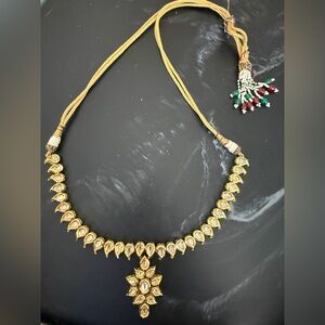 Elegant Reversible Gold Necklace with Red and Green Accents
